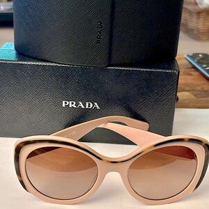 Prada Sunglasses pale pink tortoise shell trim.
